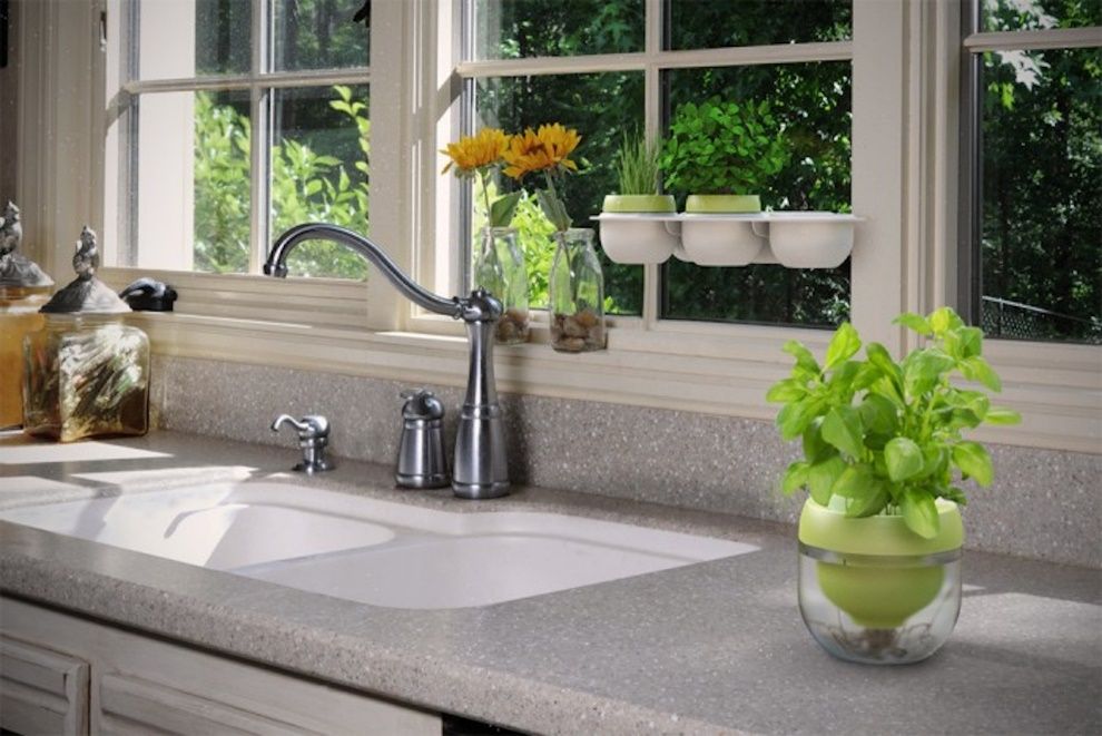 A kitchen with a sink and a window  Description automatically generated
